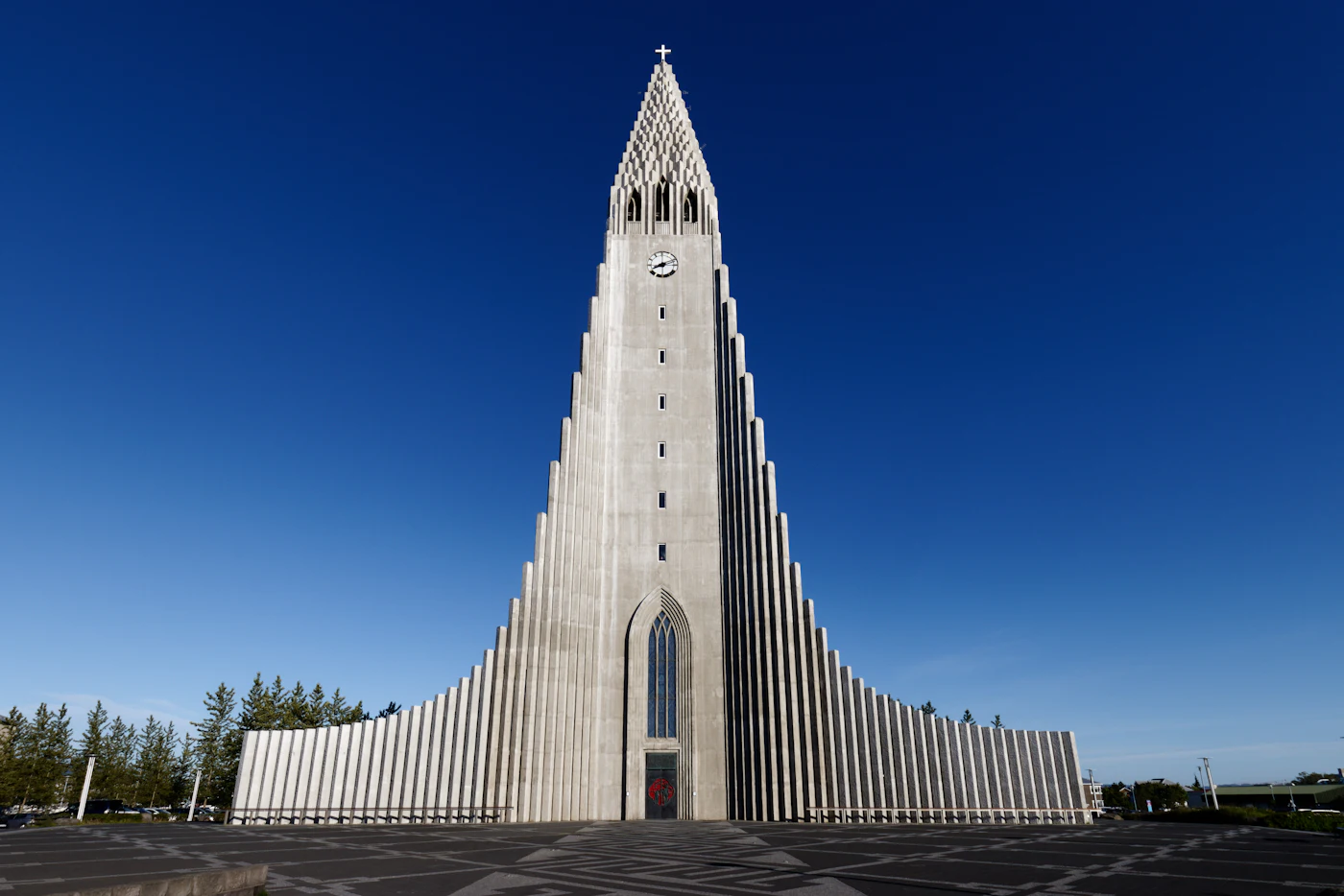 Hallgrímskirkja's concrete columns against a deep blue sky