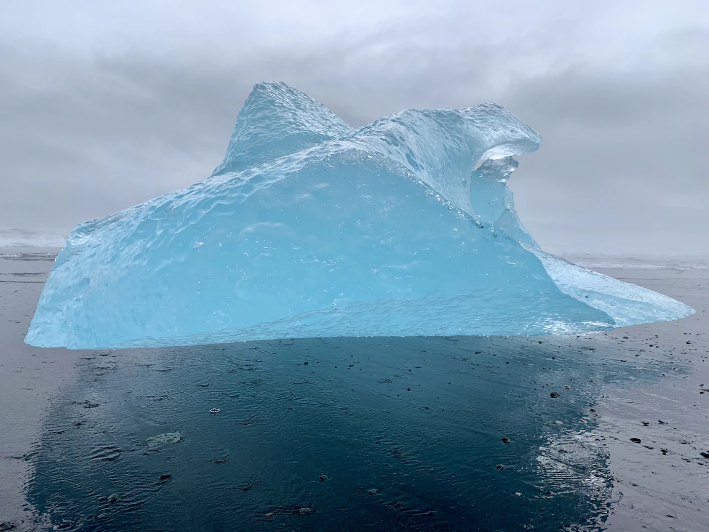 A glassy blue iceberg on Diamond Beach