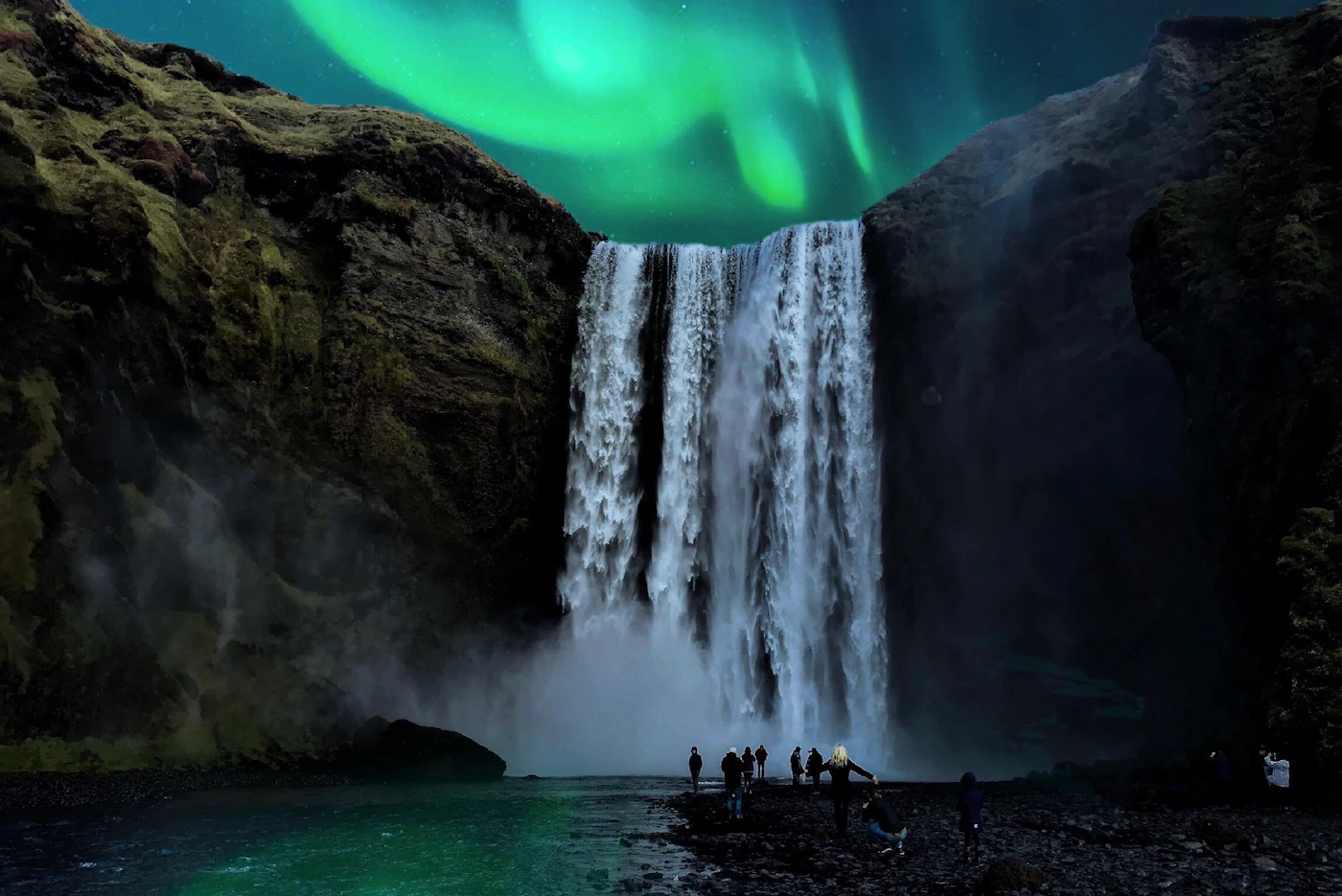 Green northern lights above Skógafoss at night